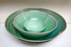Stacked green bowls