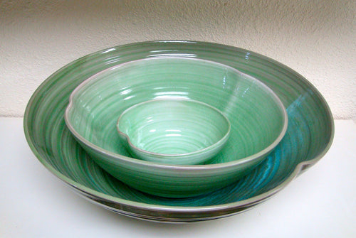Stacked green bowls