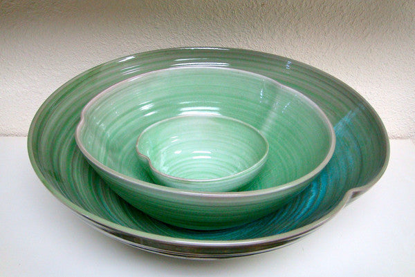 Stacked green bowls.