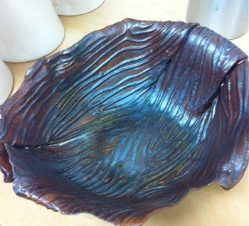 Hand-built bowl with wood effect.