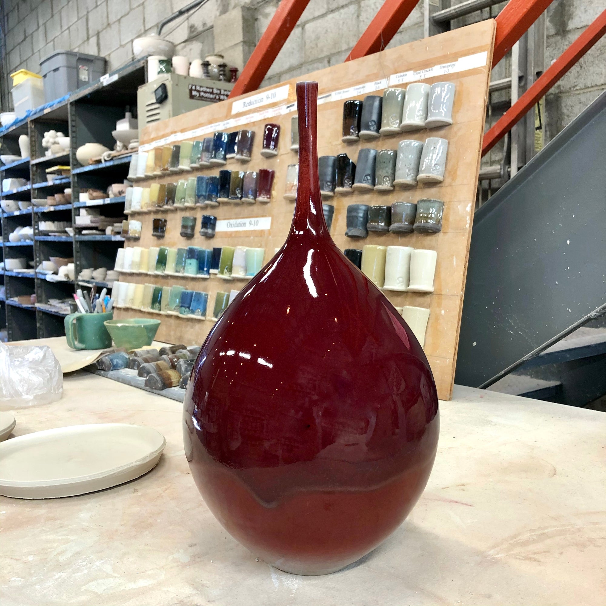 tall bottle in copper red glaze cone 10 reduction